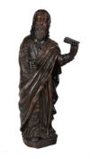 A large stained softwood model of a standing Saint