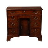 An early George III mahogany kneehole desk