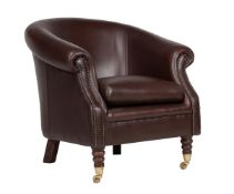 A beech and leather upholstered tub armchair