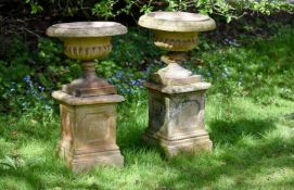 A pair of Victorian terracotta jardinières and plinth bases