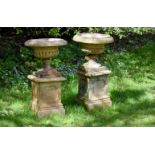 A pair of Victorian terracotta jardinières and plinth bases