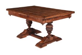 An oak and parquetry draw leaf dining table