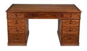 A Gothic Revival oak partners pedestal desk