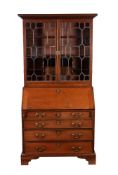 A George III mahogany and line inlaid bureau bookcase