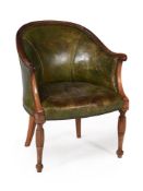 A walnut and green leather upholstered armchair