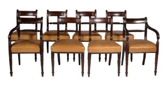 A set of six Regency mahogany and brass line inlaid dining chairs