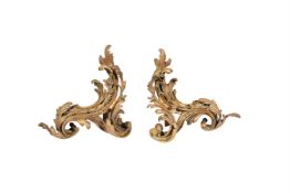 A pair of French gilt bronze chenets in Louis XV style