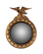 A giltwood and composition convex wall mirror in Regency style