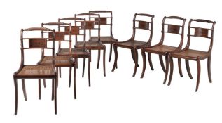 A set of eight Regency mahogany and ebonised inlaid dining chairs