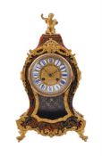 Y A red tortoiseshell and brass inlaid 'Boulle' mantel clock