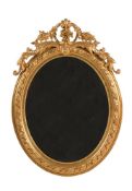 An oval giltwood wall mirror