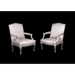 A pair of French silvered wood and upholstered open armchairs