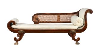 A Regency simulated rosewood and upholstered chaise longue or day bed