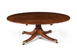 A Regency oval dining table