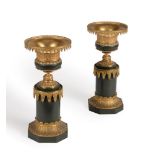 A pair of gilt and green painted metal candlesticks in Gothic taste