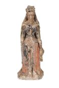 A carved and polychrome painted stone, probably limestone, model of a female saint