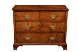 A walnut and featherbanded chest of drawers