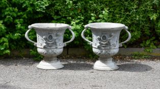 A pair of lead garden urns