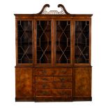 A mahogany and inlaid library bookcase in George III style