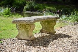 A composite stone and limestone garden seat