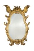 A carved giltwood oval pier mirror