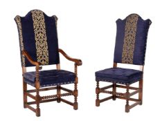 A set of fourteen oak and upholstered dining chairs