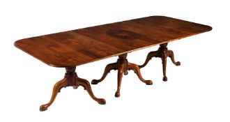 A walnut triple pillar dining table in early George III style