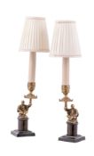 A pair of gilt bronze candlesticks