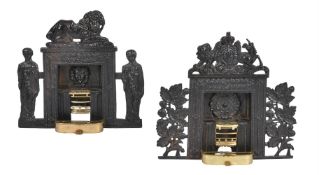 A pair of cast iron miniature models of chimney pieces