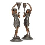 A PAIR OF CONTINENTAL ART DECO FIGURAL METAL CANDLE HOLDERS