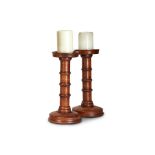 A PAIR OF TURNED AND STAINED WOOD PRICKET CANDLESTICKS