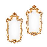 A PAIR OF CARVED GILTWOOD WALL MIRRORS IN GEORGE III STYLE