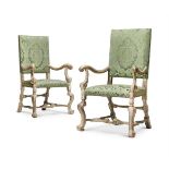 A PAIR OF CARVED WOOD, PAINTED AND SILVERED ARMCHAIRS