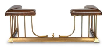 A BRASS AND LEATHER UHOLSTERED EXTENDING CLUB FENDER