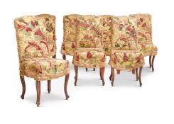 A SET OF FOURTEEN LOUIS XV STYLE WALNUT AND UPHOLSTERED SIDE CHAIRS