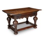 A OAK SIDE TABLE IN 17TH CENTURY FLEMISH STYLE