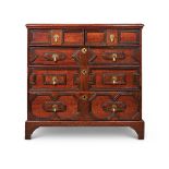 AN OAK CHEST OF DRAWERS, 17TH CENTURY AND LATER