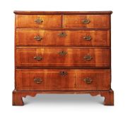 A WALNUT AND PINE CHEST OF DRAWERS