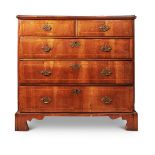 A WALNUT AND PINE CHEST OF DRAWERS