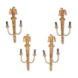 A SET OF FOUR REGENCY STYLE GILTWOOD WALL APPLIQUES