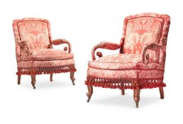 A PAIR OF WALNUT AND PARCEL-GILT FRAMED SALON ARMCHAIRS