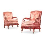 A PAIR OF WALNUT AND PARCEL-GILT FRAMED SALON ARMCHAIRS