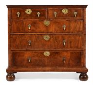 A QUEEN ANNE WALNUT AND LINE INLAID CHEST OF DRAWERS, CIRCA 1710