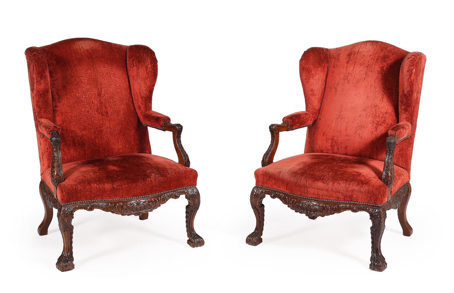 A PAIR OF CARVED WALNUT AND UPHOLSTERED WING ARMCHAIRS, LATE 19TH CENTURY