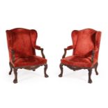 A PAIR OF CARVED WALNUT AND UPHOLSTERED WING ARMCHAIRS, LATE 19TH CENTURY