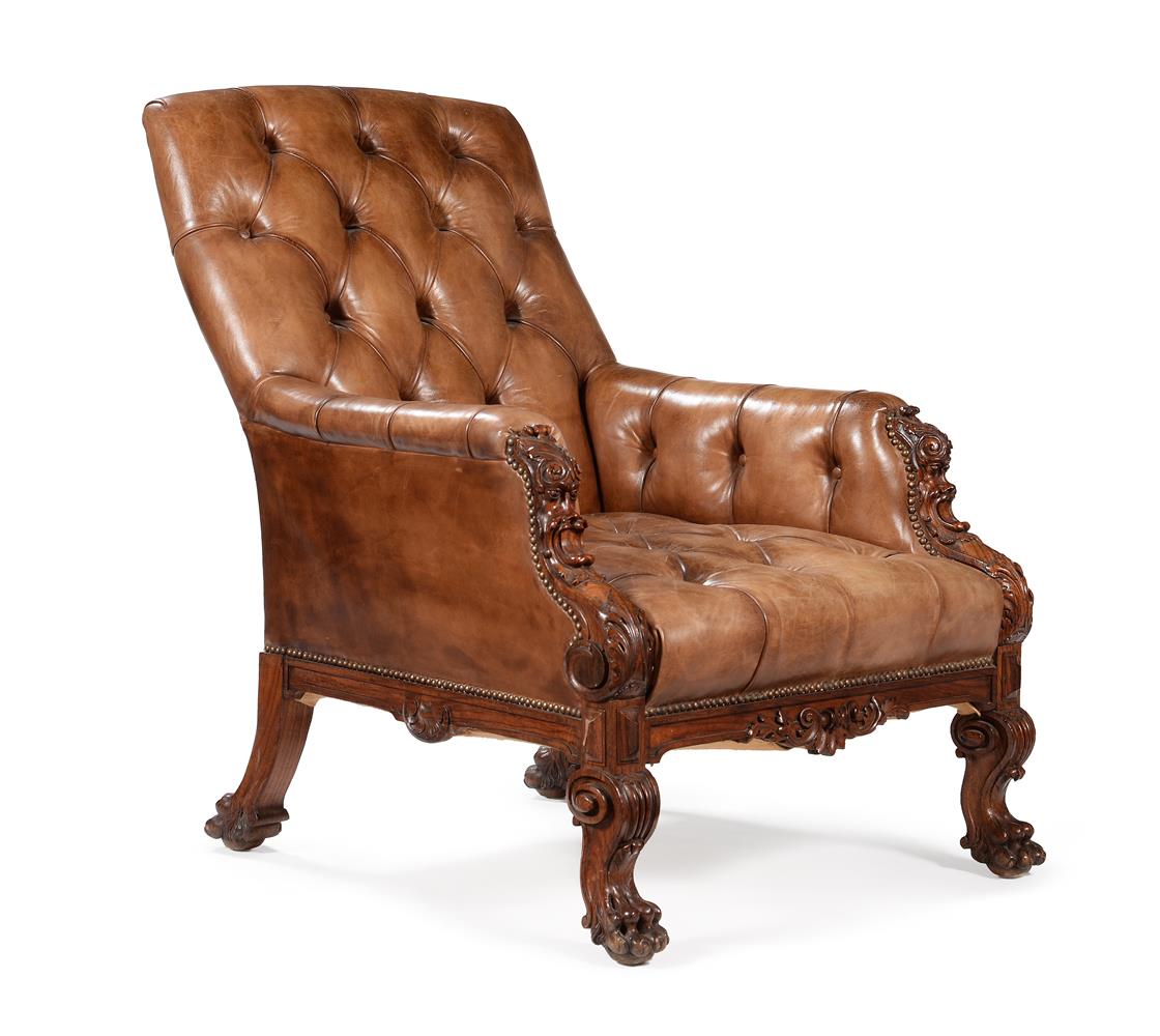A VICTORIAN CARVED WALNUT AND BUTTONED LEATHER UPHOLSTERED LIBRARY ARMCHAR, SECOND HALF 19TH CENTURY
