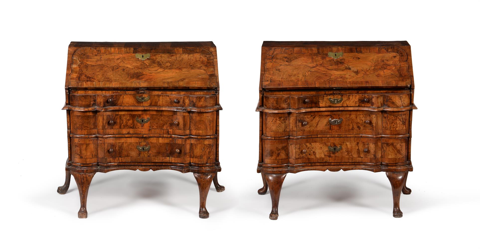 A NEAR PAIR OF SOUTH GERMAN FIGURED WALNUT AND CROSSBANDED BUREAUX, MID 18TH CENTURY