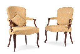 A PAIR OF GEORGE III CARVED BEECH AND UPHOLSTERED ARMCHAIRS, IN THE FRENCH HEPPLEWHITE TASTE