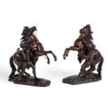 AFTER GUILLAUME COUSTOU (1677-1746), A PAIR OF FRENCH BRONZES OF 'THE MARLY HORSES', CIRCA 1880