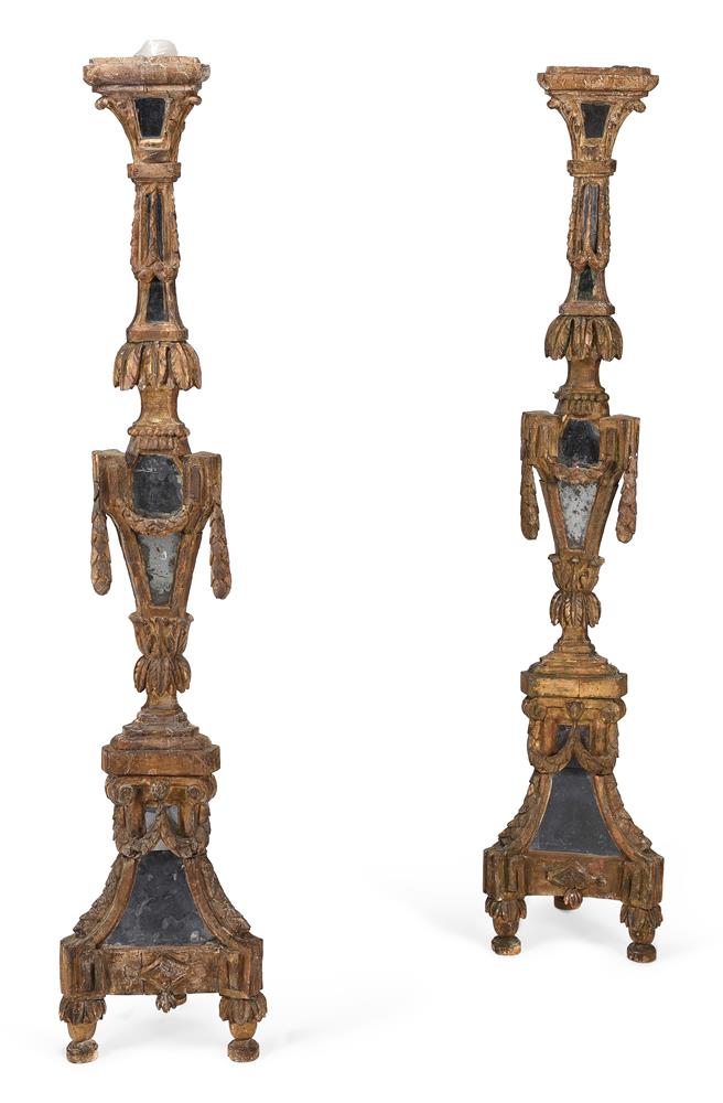 A PAIR OF CONTINENTAL GILTWOOD ALTAR STICKS, SECOND HALF 18TH CENTURY